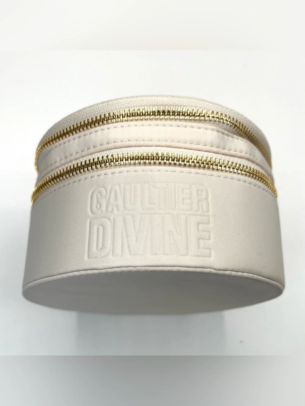 Gaultier Divine Vanity - Round Cosmetic Bag with Gold Accents in Cream